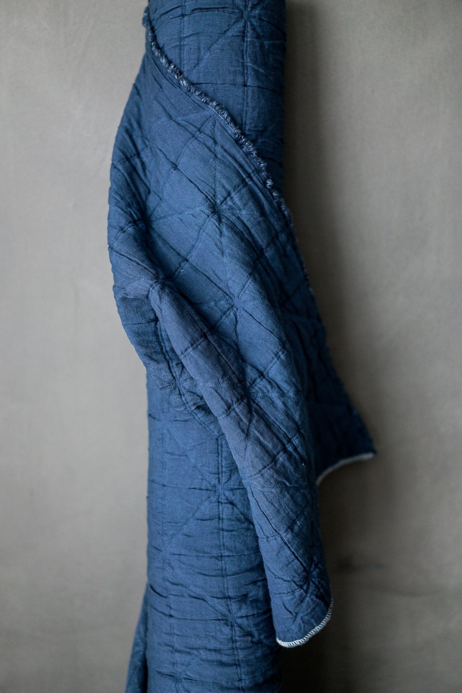 marine blue jacquard fabric in a light grey background