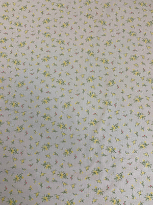 pale pink lightweight flat cotton seersucker with a ditsy yellow floral print fabric.