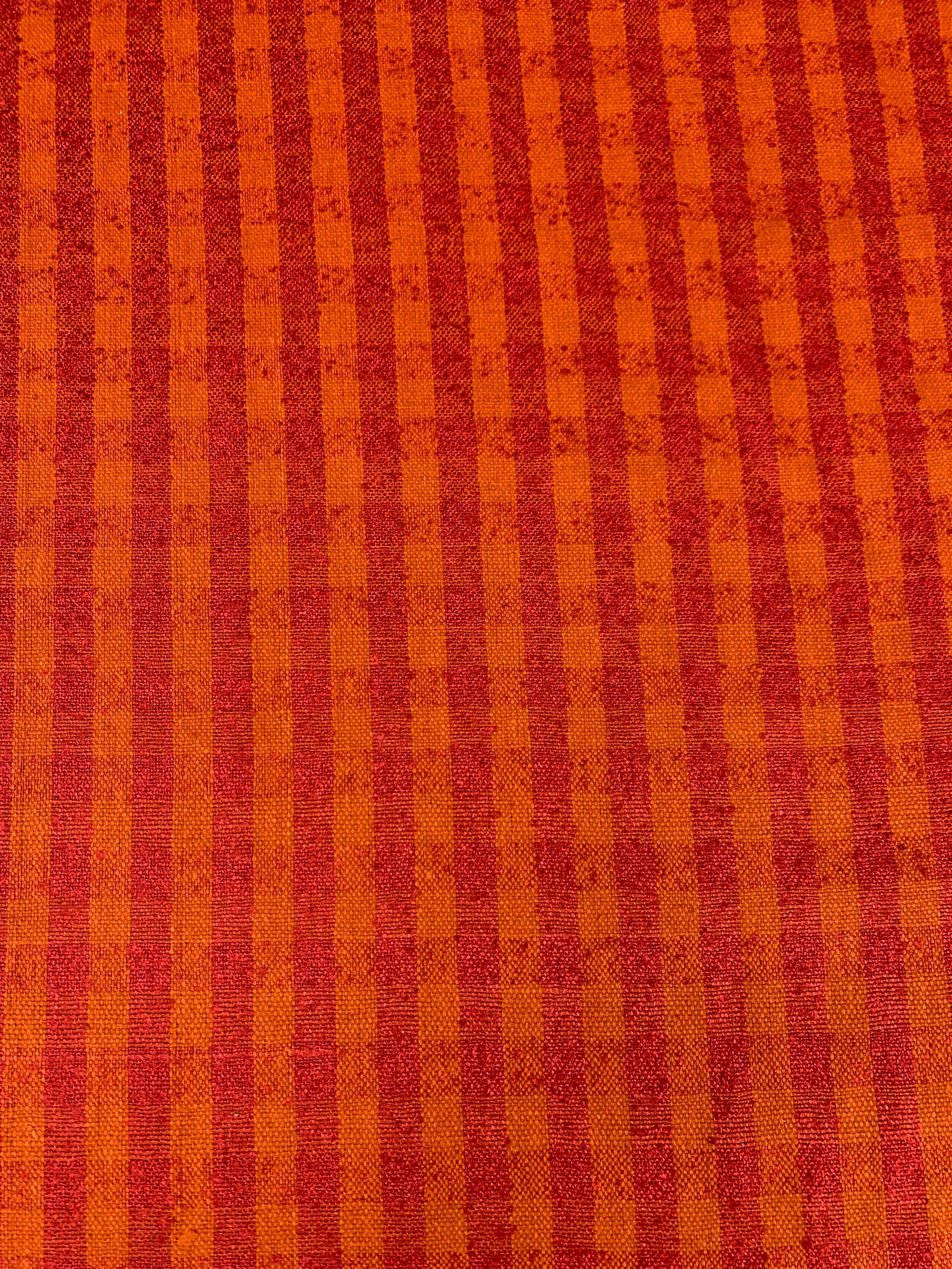 close up of raw silk in a orange and red check