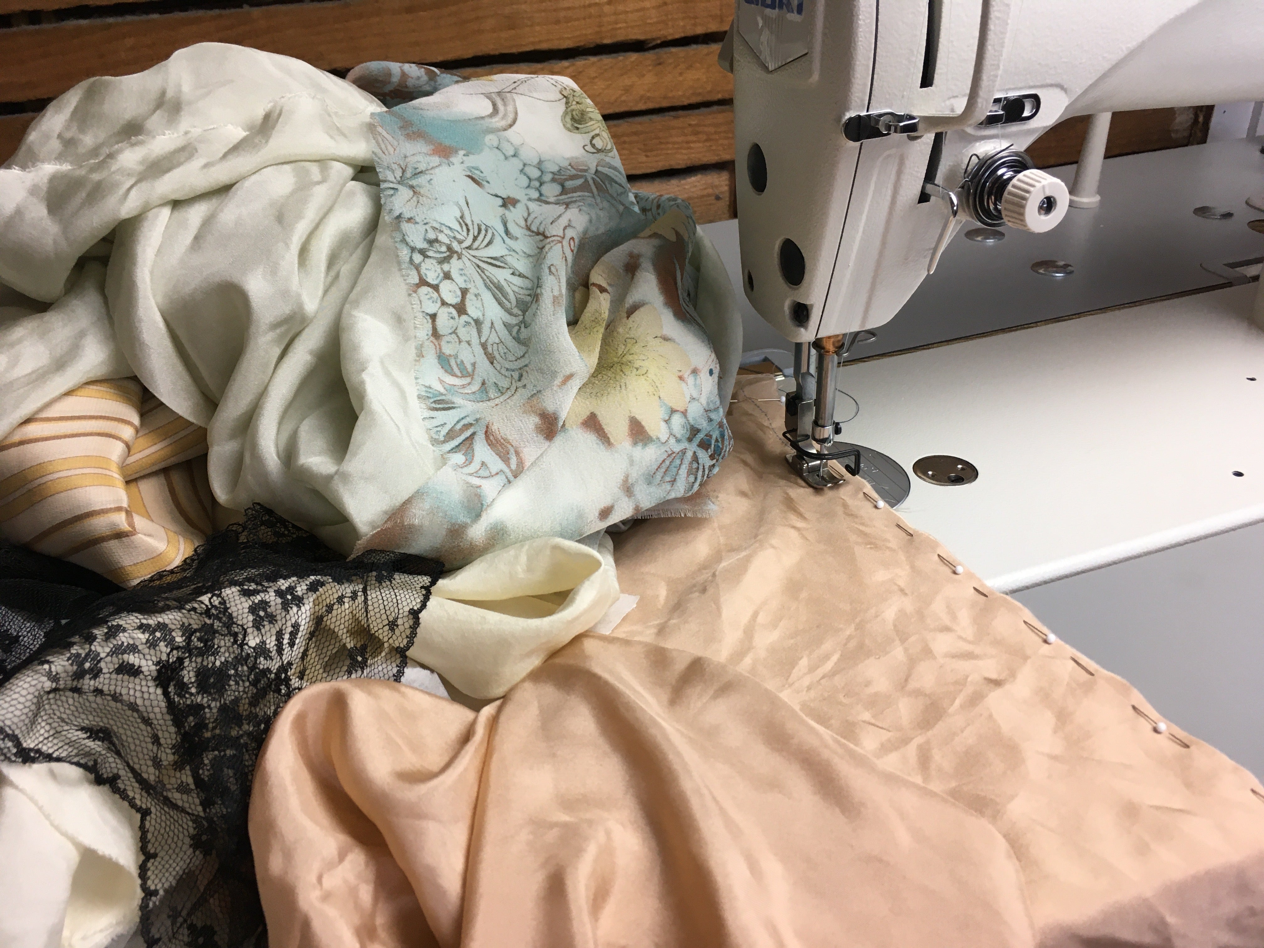 How would a seamstress hem up a dress with scalloped laced hem?