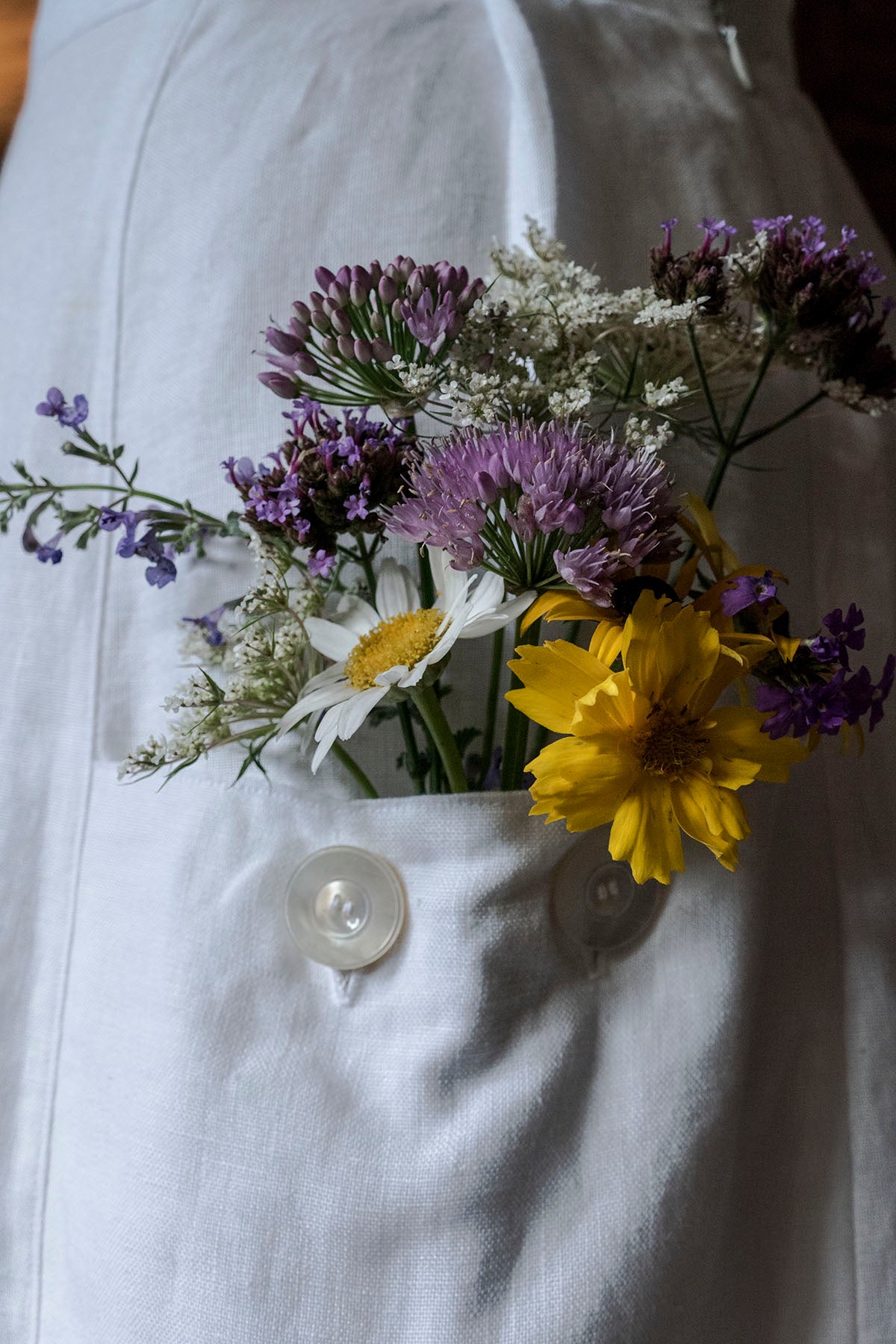 white pocket with flowers sitting in it