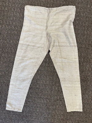 cream colored pants on a grey floor
