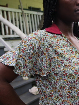 Close up of flutter sleeve of vintage patterned tea frock