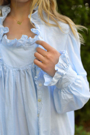 closeup of nightgown sleeve cuff and ruffle.