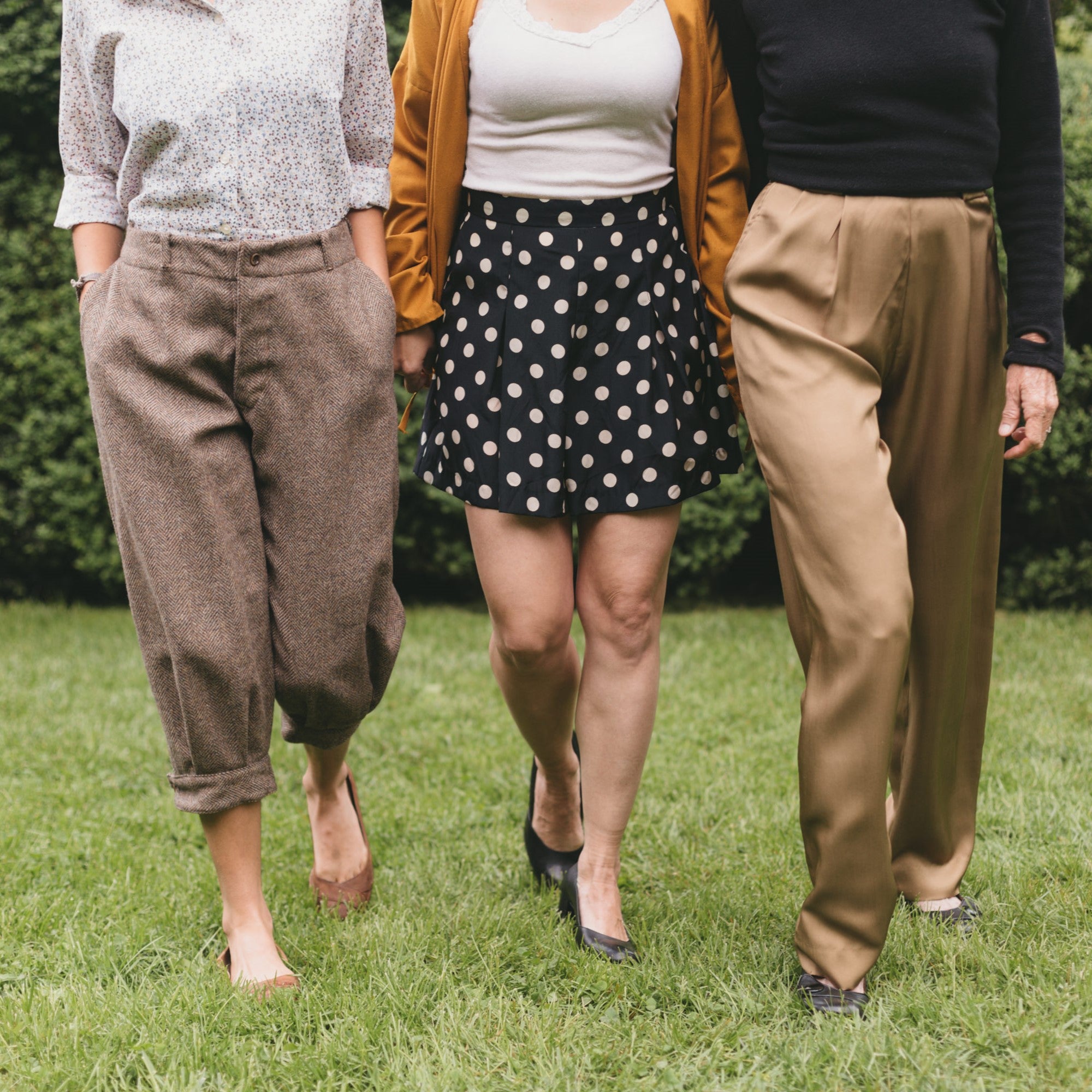 Legs of three women walking in Hollywood Pants (shorts, and knickers).
