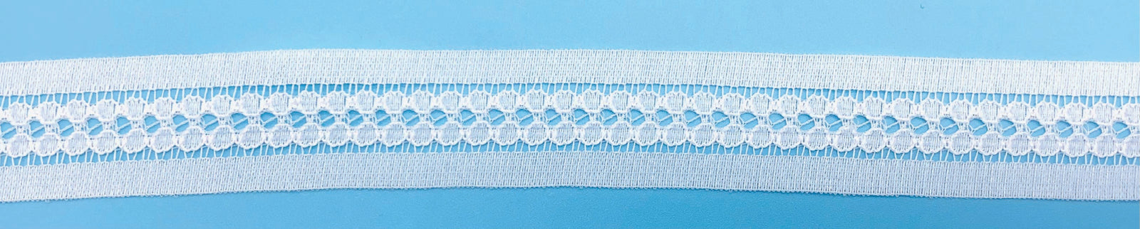 white insertion lace on a blue back ground