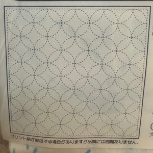 Grid pattern on a paper surface with text at the bottom