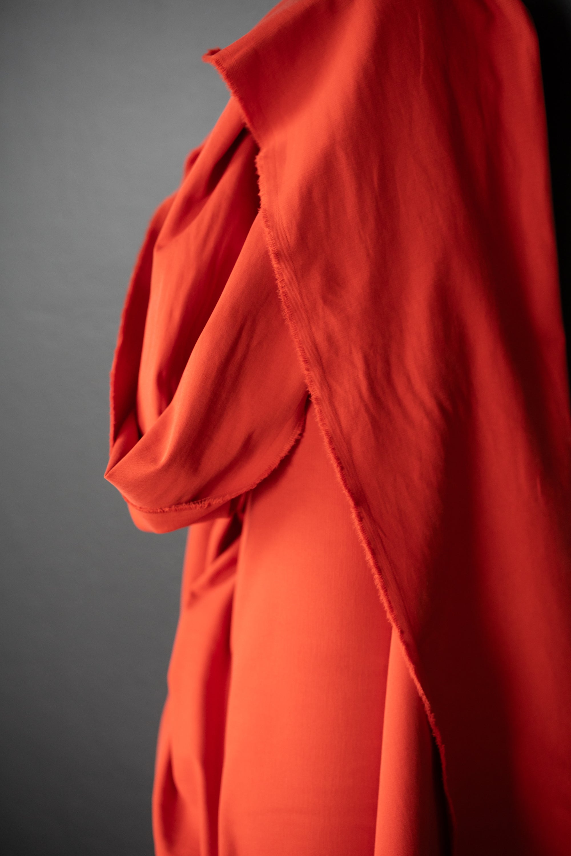 Sanded twill fabric in a bright red orange color