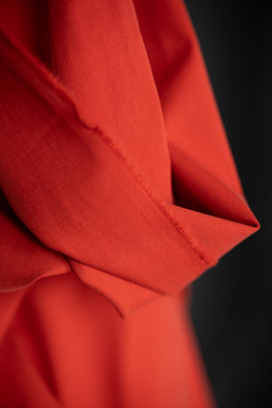 close up Sanded twill fabric in a bright red orange color