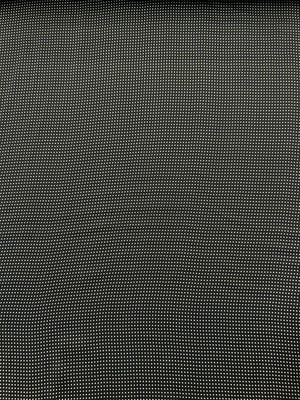 Close-up of a mini black and white polka dot fabric.