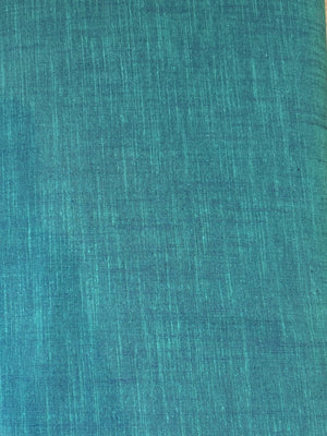 Handloom cotton fabric in a teal color.