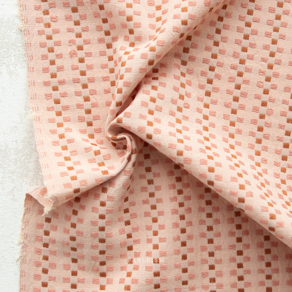 100% cotton in a basket weave of soft pinks with a fun off set checkered pattern.