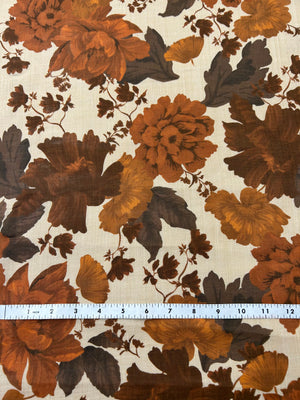 Floral peony pattern with brown and orange flowers on a light tan background, with a ruler for scale.