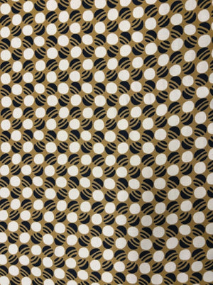 Patterned fabric with black, white, and gold design
