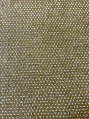 Close-up of a textured olive fabric with small white dots