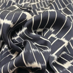 Navy blue fabric with white abstract pattern