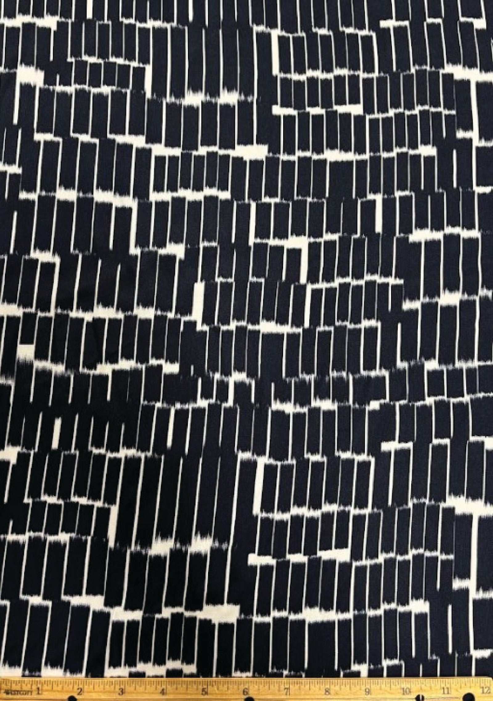 Navy blue fabric with white abstract pattern