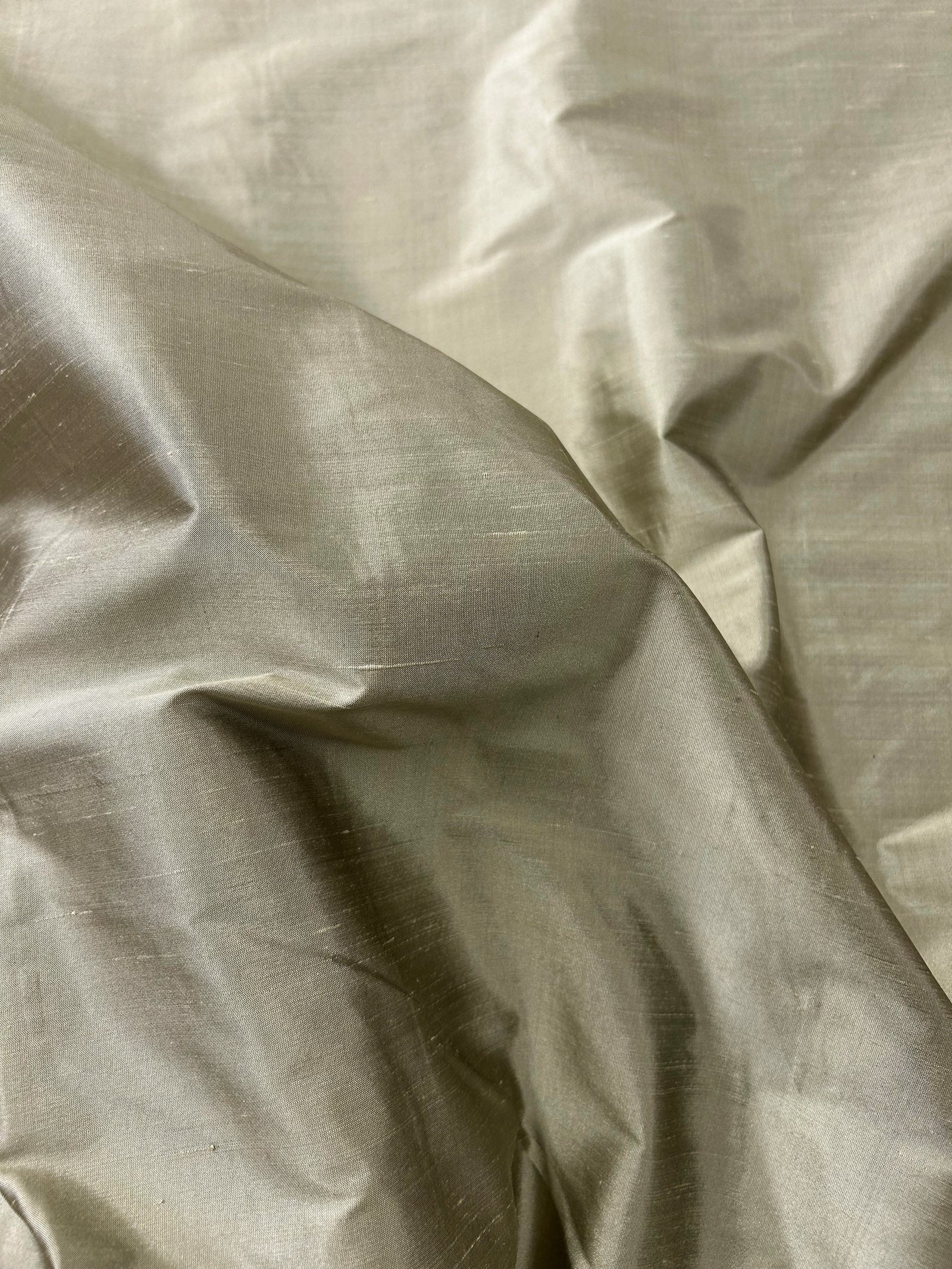 Close-up of swirled beige fabric