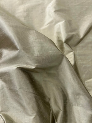 Close-up of taupe fabric with folds