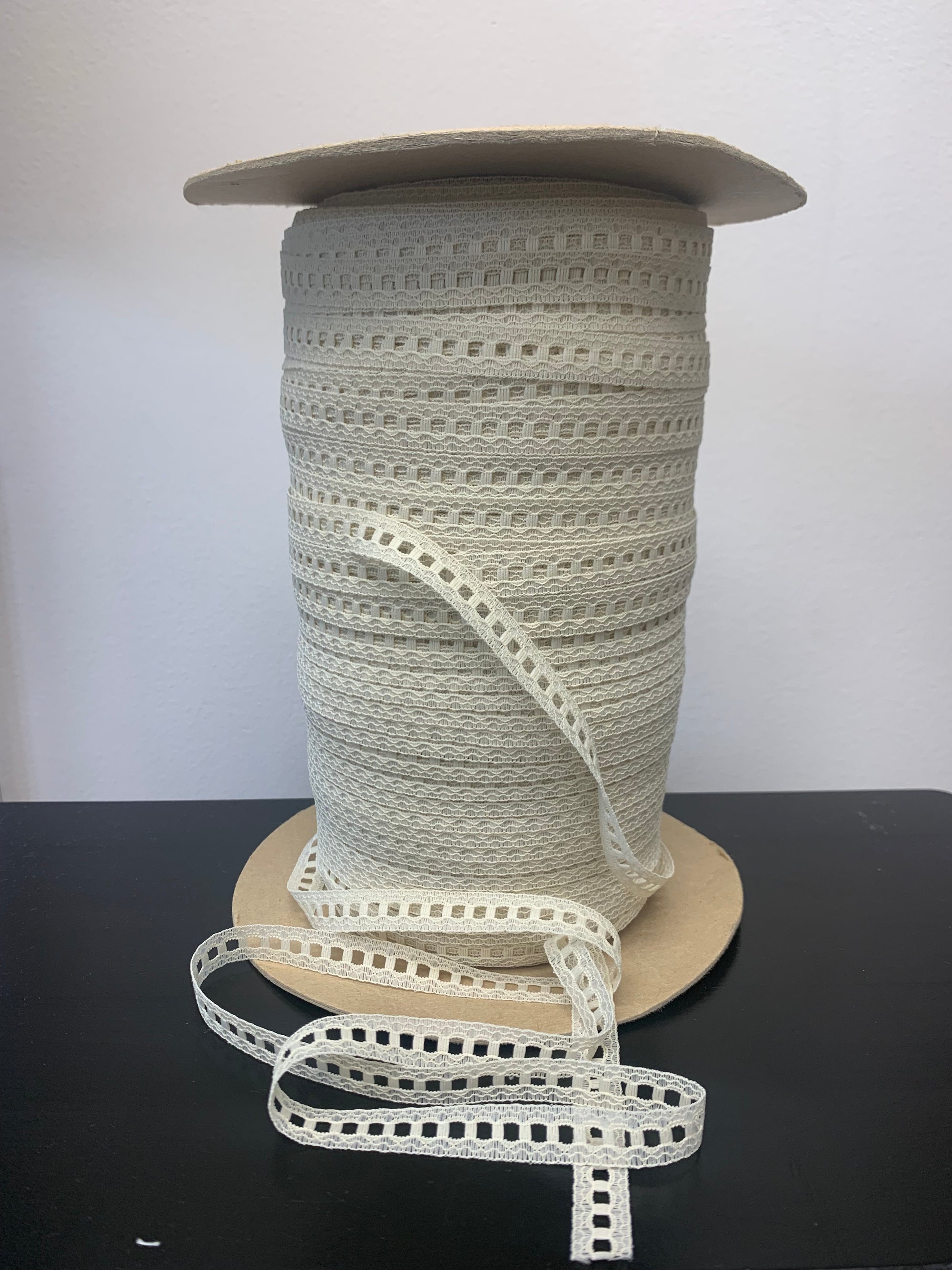 roll of ivory beading lace trim.
