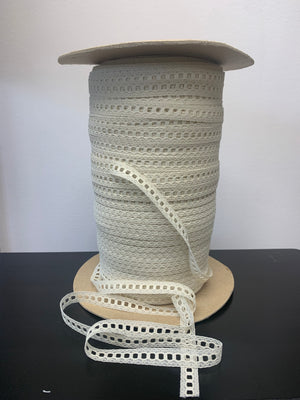 roll of ivory beading lace trim.