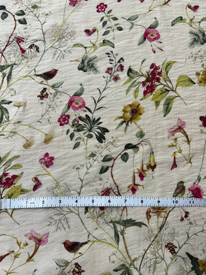 Floral fabric pattern with a ruler for scale on a beige background