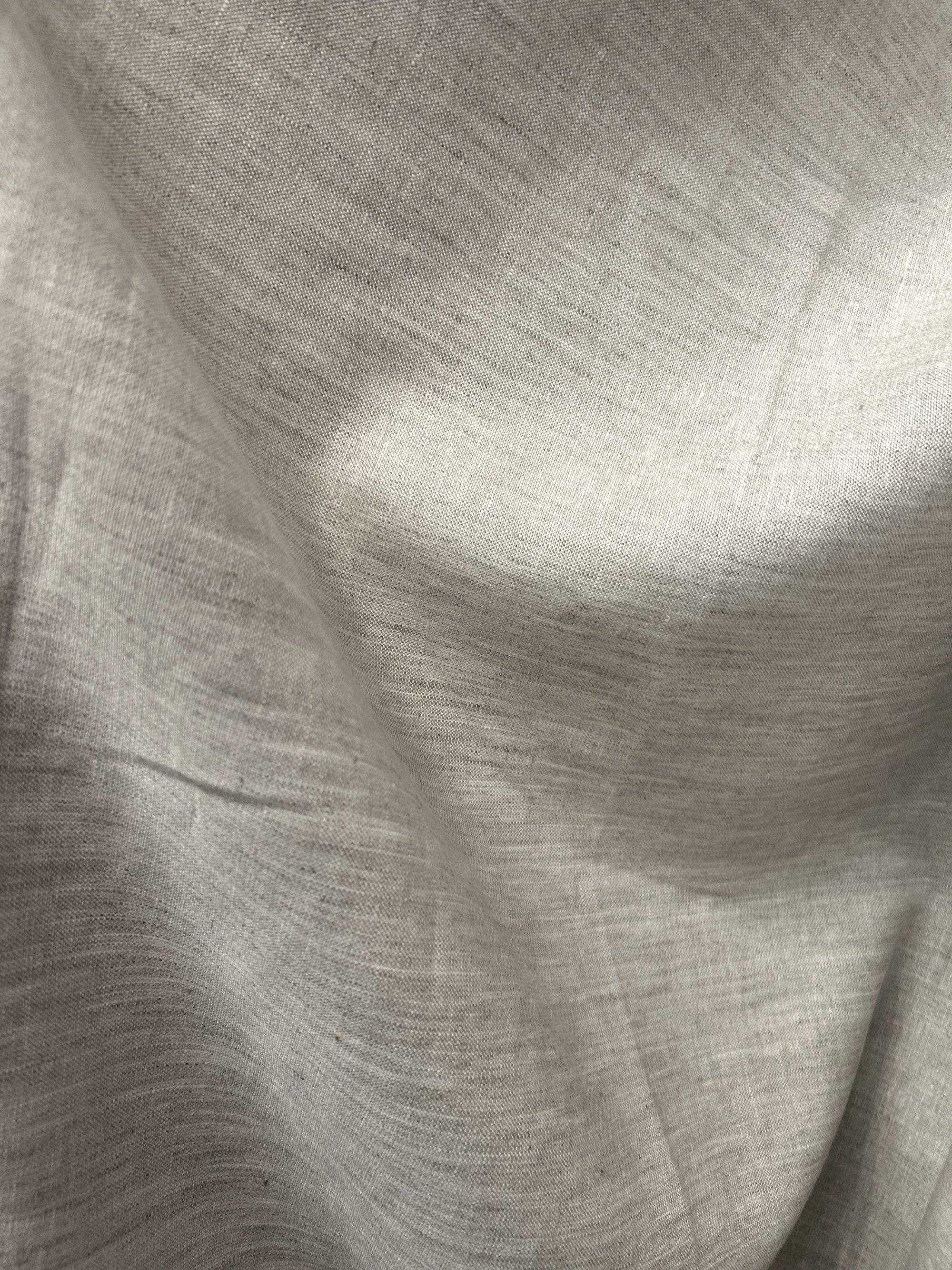  neutral medium-weight linen in a calming almond beige color draped.