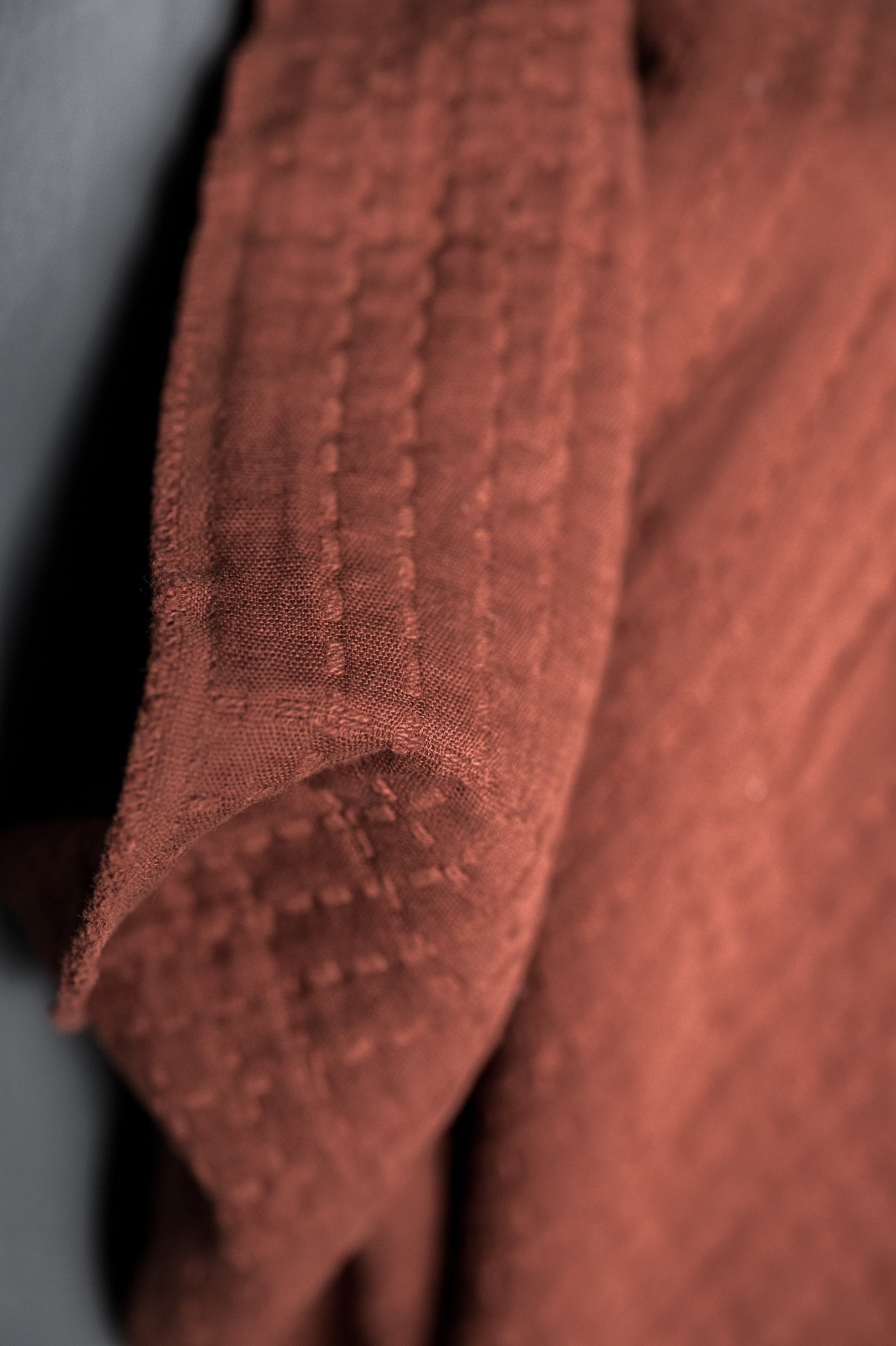 close up of deep rust jacquard fabric