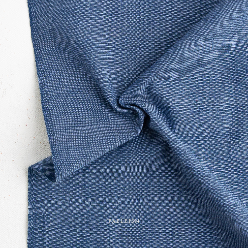 Close-up of blue fabric  on a light background