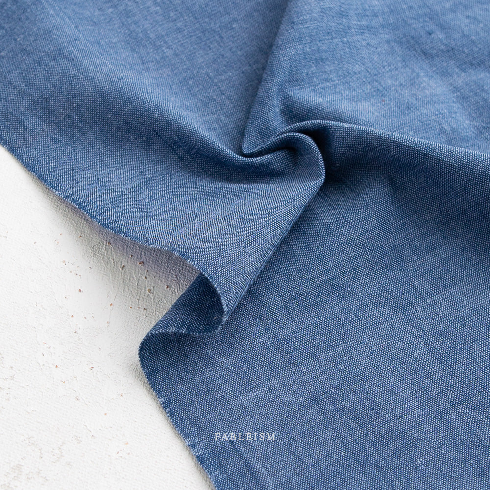 Close-up of blue fabric  on a light background