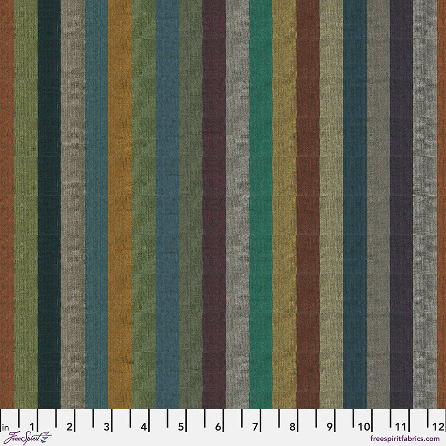 Striped fabric pattern with multicolor vertical stripes or forest greens, teal, mustard, rust, plum, and soft neutrals. With a ruler on the bottom.
