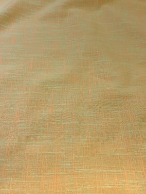 Handloom cotton fabric in a light yellow color.