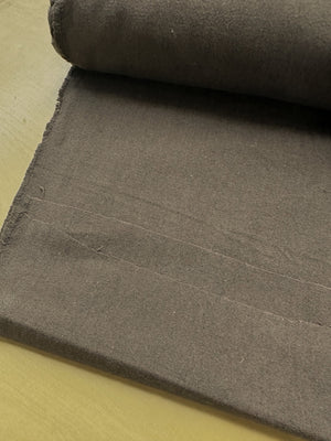 section of brown fabric on a wooden table