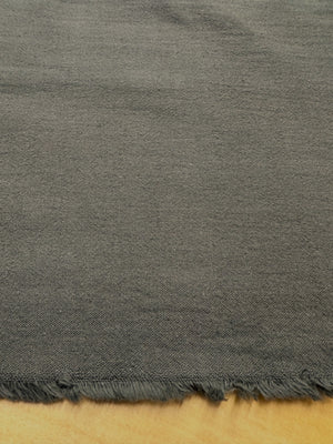 section of brown fabric on a wooden table