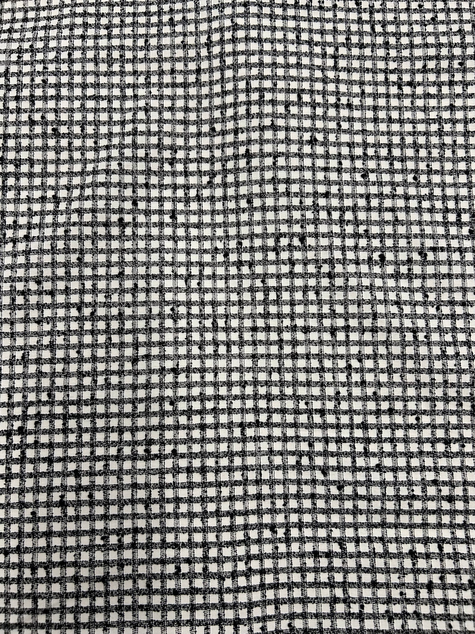 a nubby cotton fabric in a black and white check pattern.