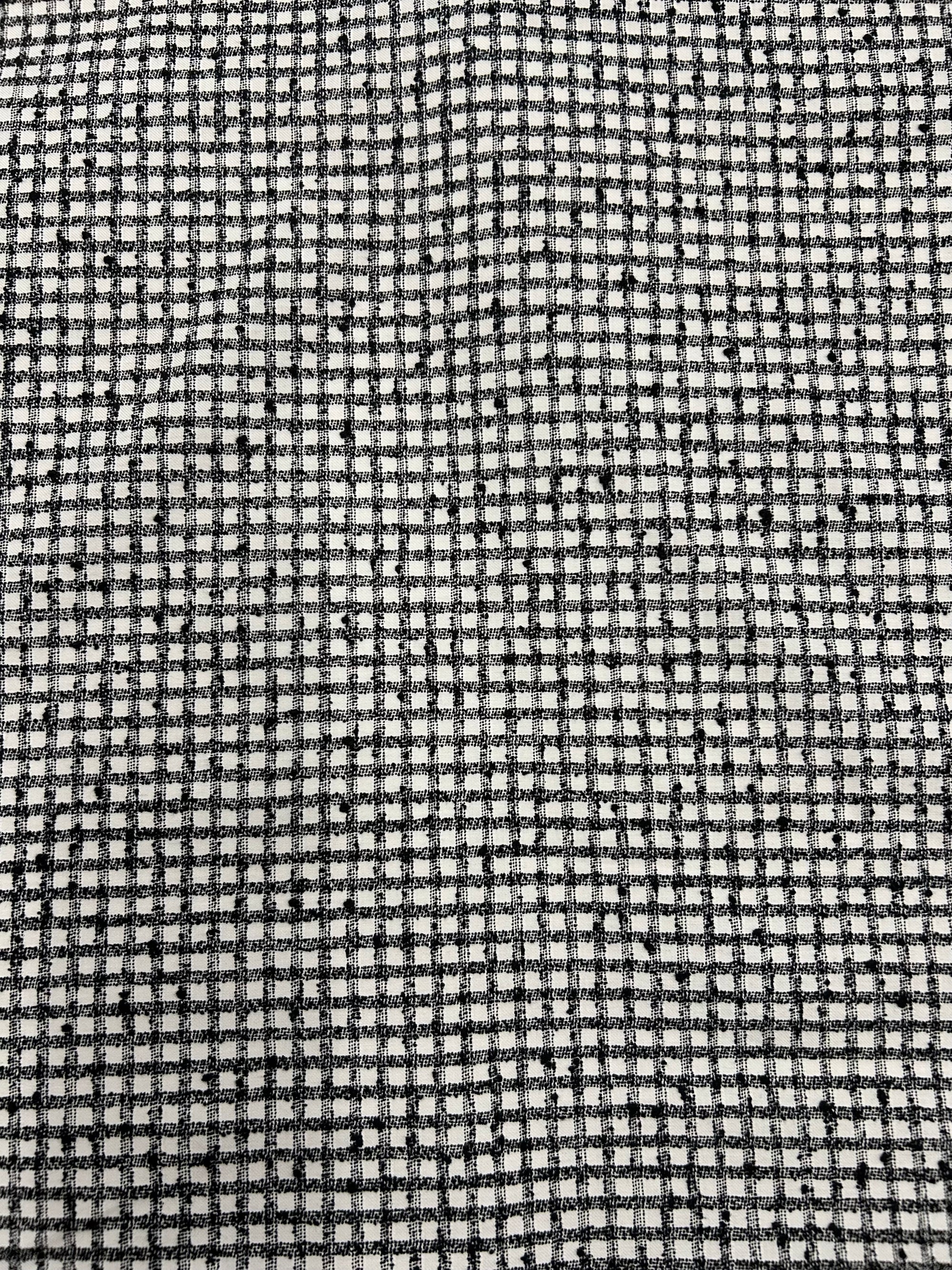 a nubby cotton fabric in a black and white check pattern.