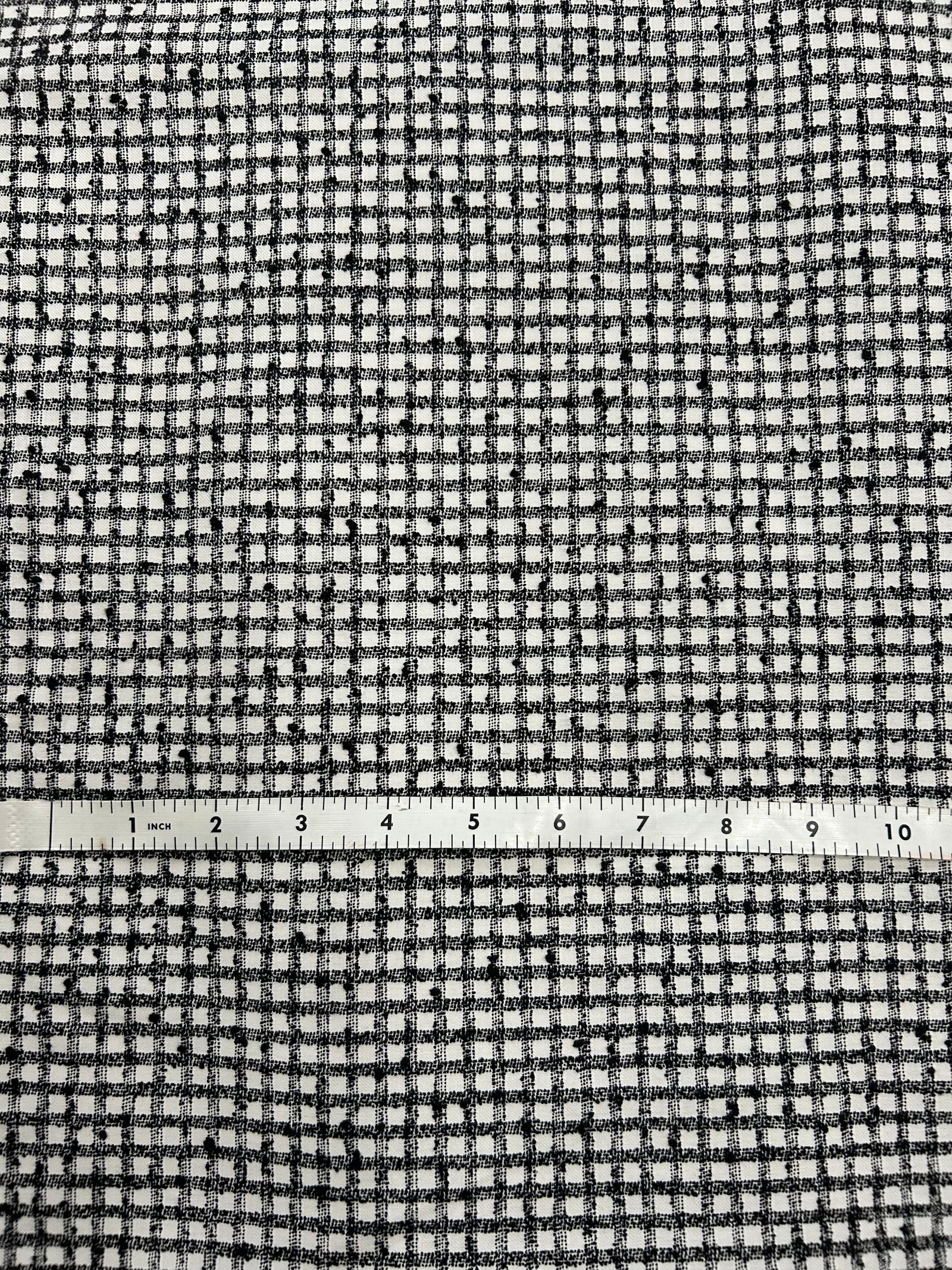 a nubby cotton fabric in a black and white check pattern.