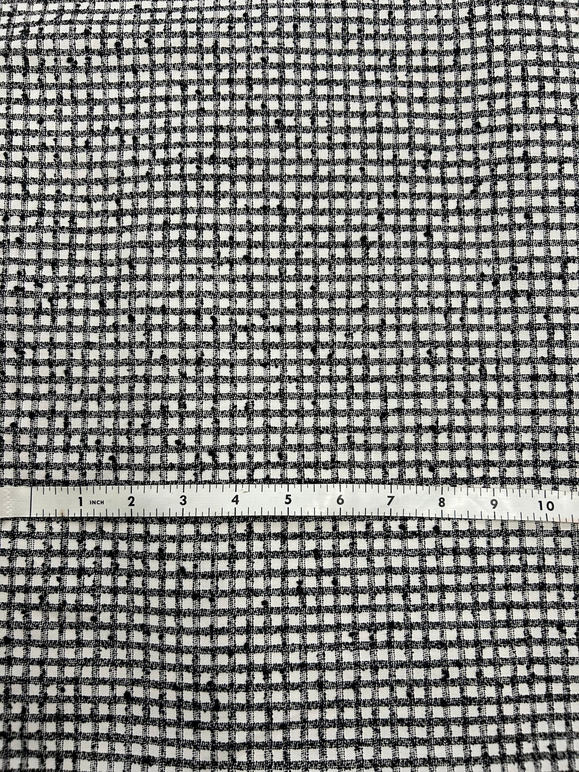 a nubby cotton fabric in a black and white check pattern.