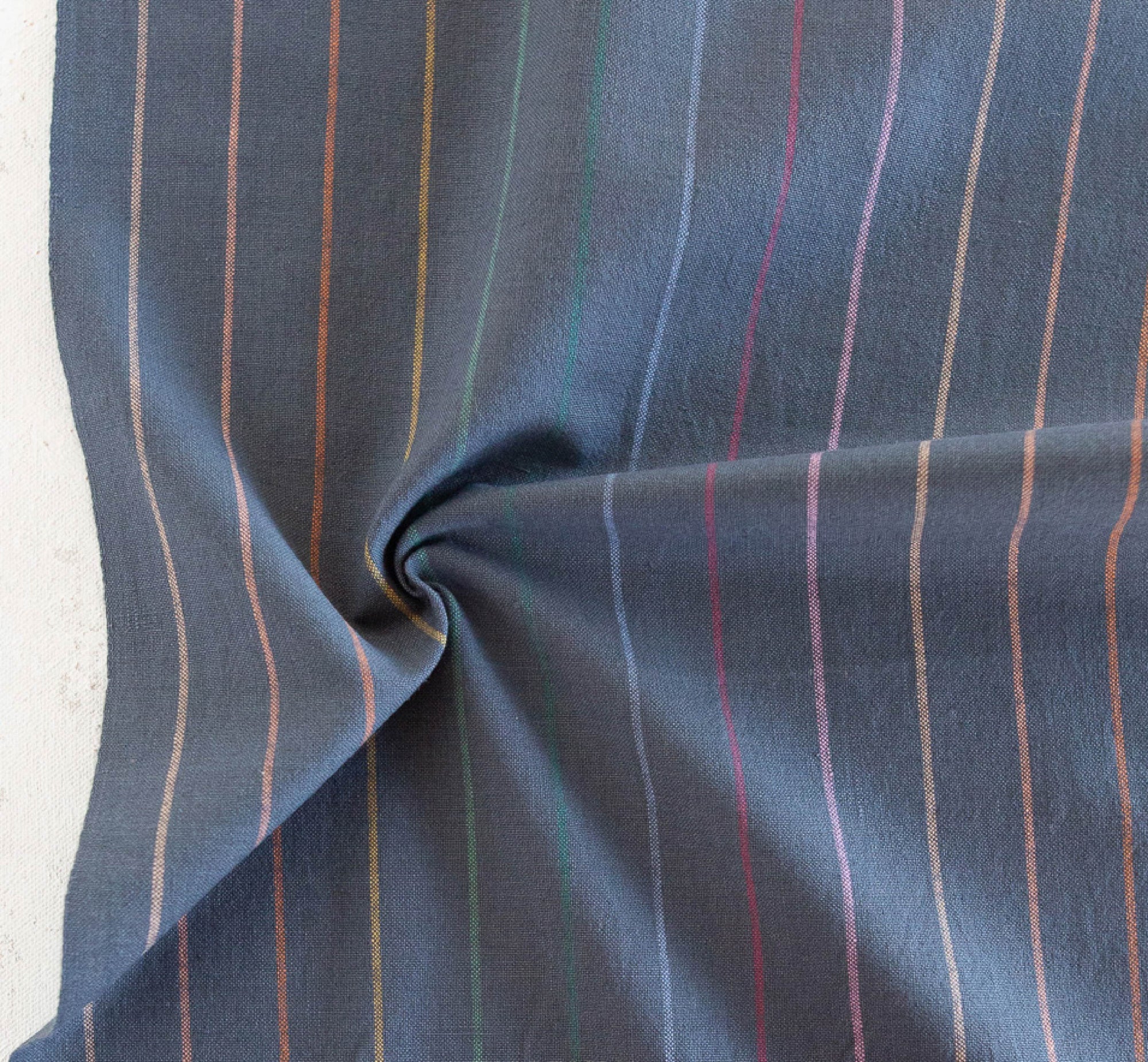 grey fabric with rainbow skinny stripes