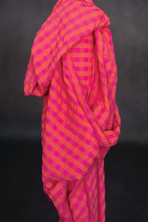 A summery bouncy cotton seersucker in a bright combination of fuchsia and orange.