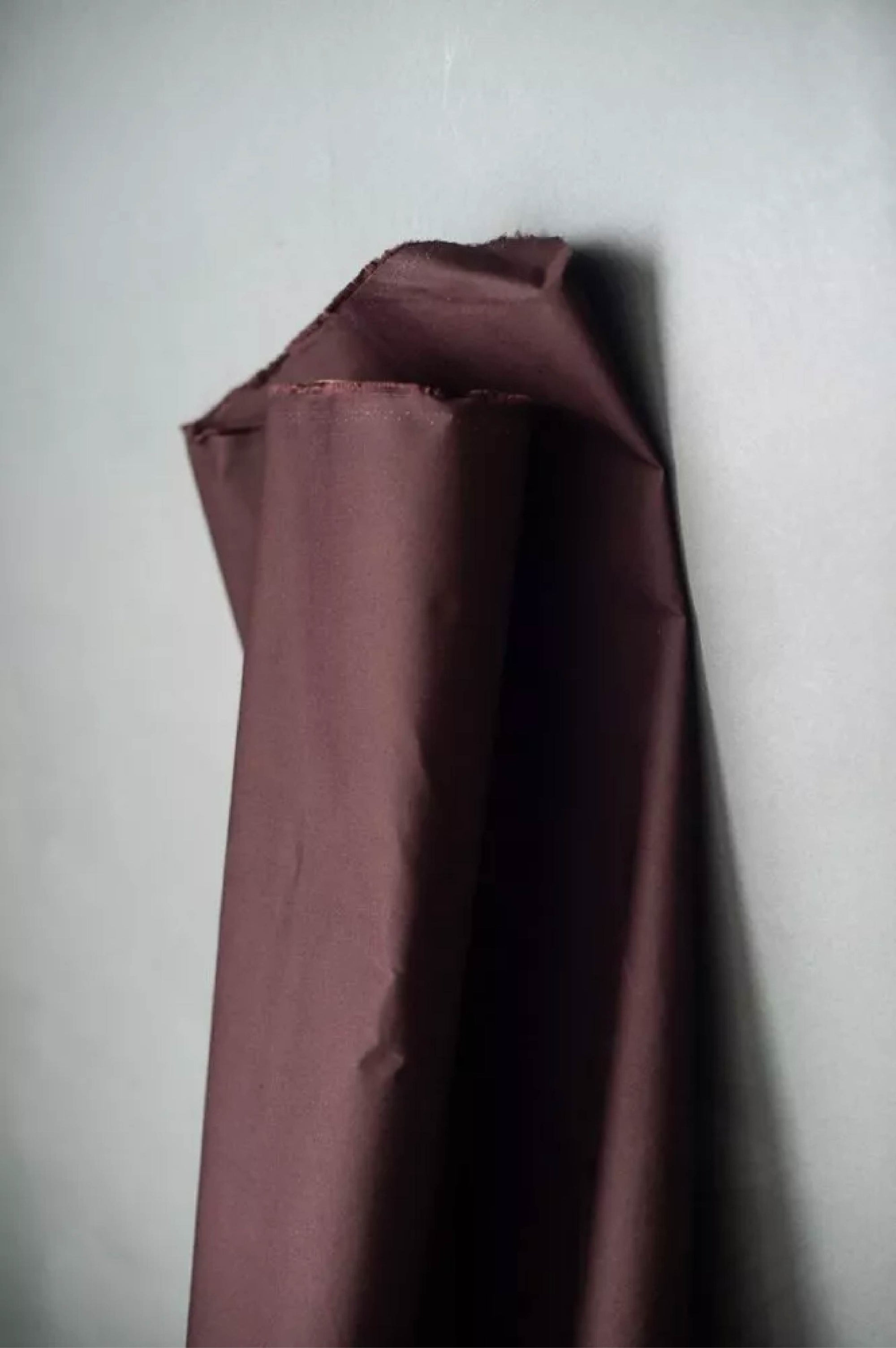 oilskin fabric draped over a gray surface
