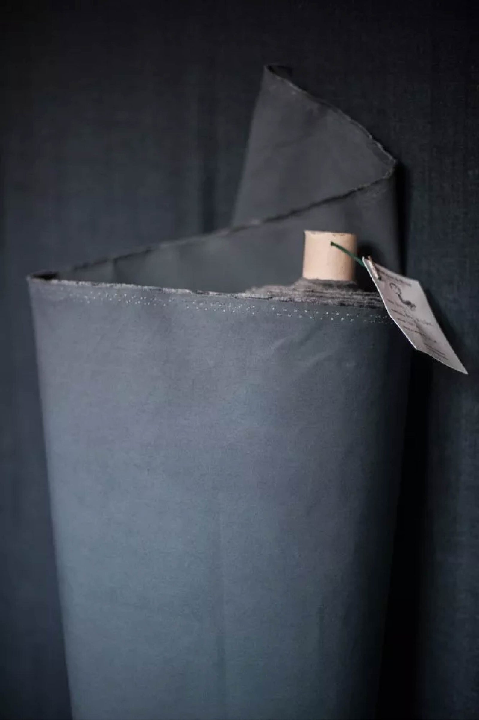 Close-up of a dark gray fabric with a textured surface
