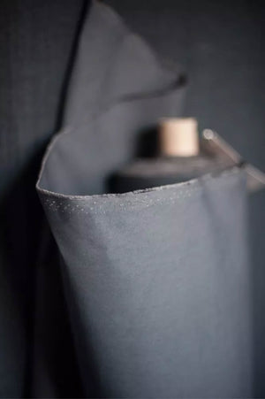 Close-up of a dark gray fabric with a textured surface
