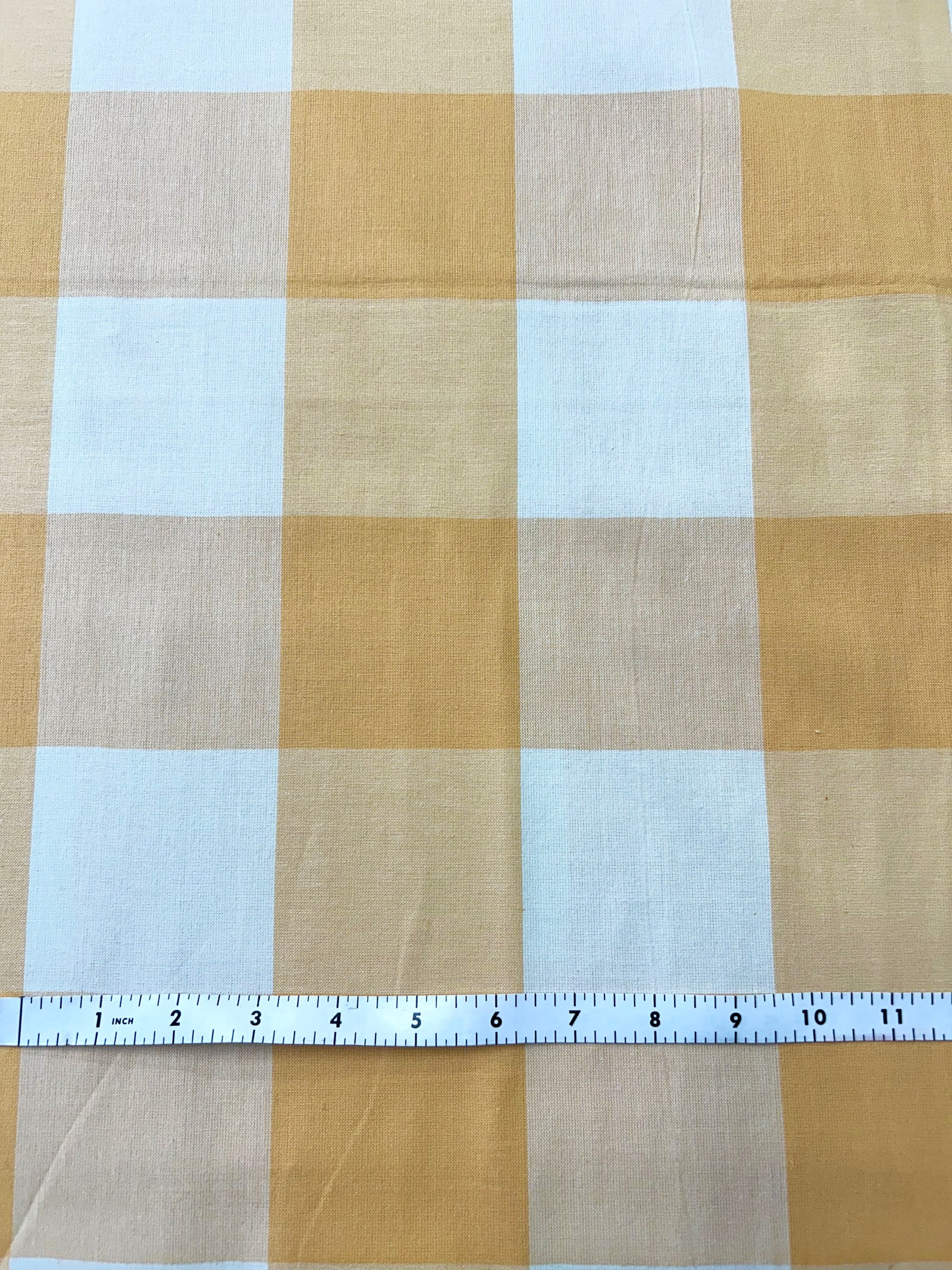 Close-up of yellow and white checkered fabric.