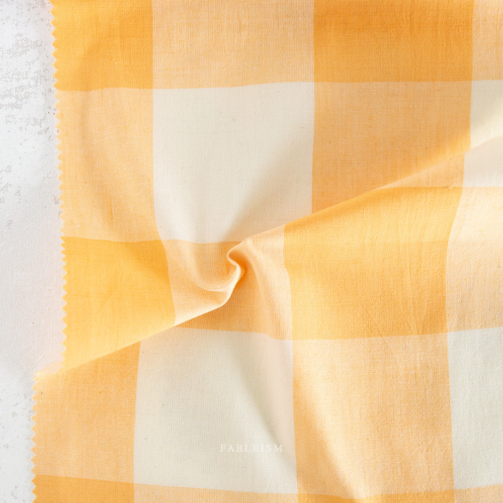 Close-up of yellow and white checkered fabric.