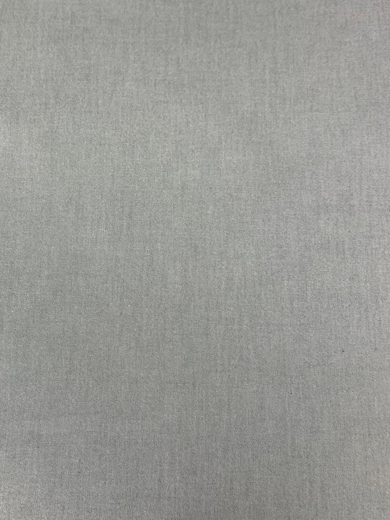  A close up of a crisp cotton oxford shirting fabric in a basket weave of gray and white