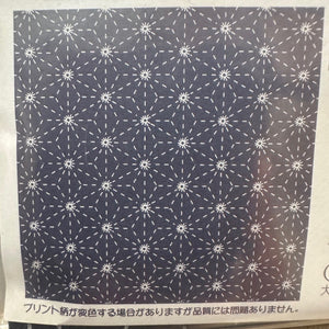 Navy fabric with white geometric pattern on a white background