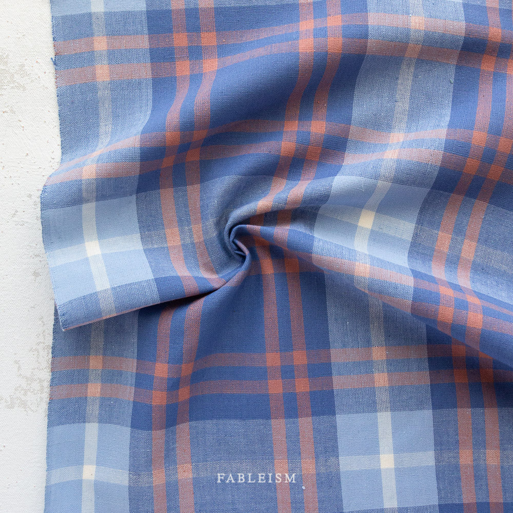 100% plaid cotton fabric with spring dreamy colors of peaches, blues and periwinkle.