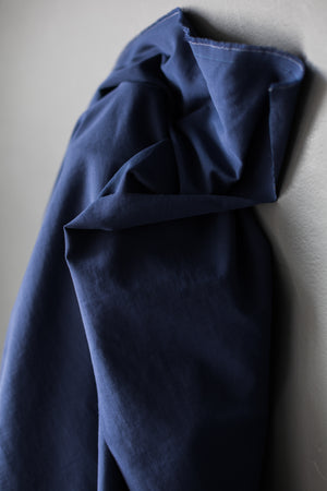 navy sanded twill fabric on a light grey background