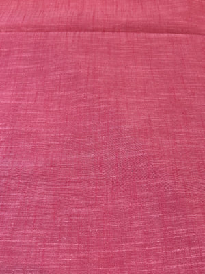 Handloom cotton fabric in a red color.